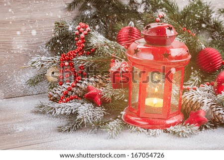 christmas lantern with evergreen tree and snow