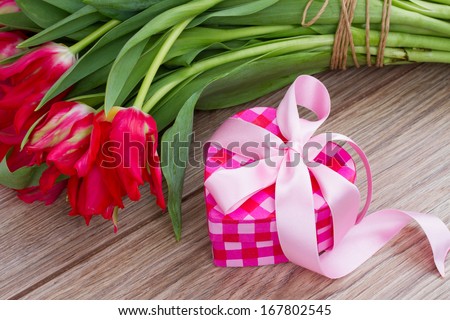 pink present box for valentines day with flowers