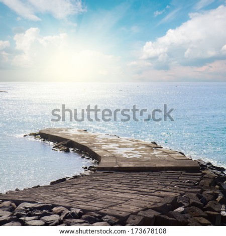 stone pier in the calm blue  see at sunny day