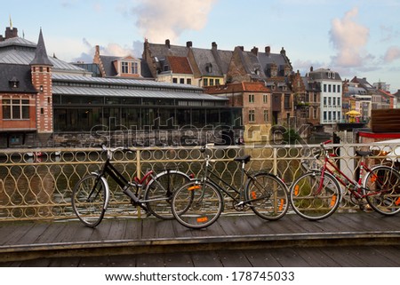 Scene in old town with bikes on bridge, Ghent, Belgium