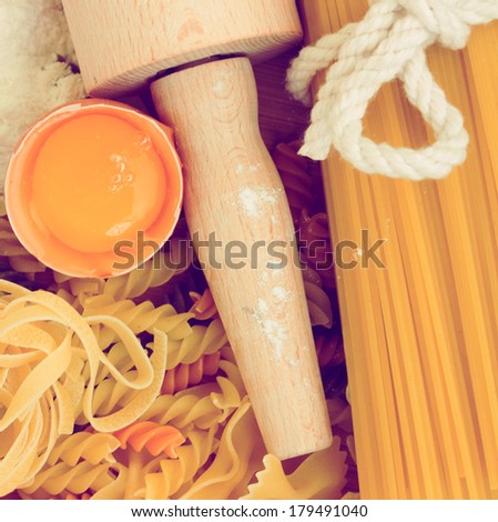 Ingredients for making pasta - flour and eggs on wooden table