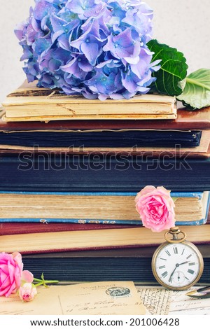 vintage  pile of books and letters with flowers