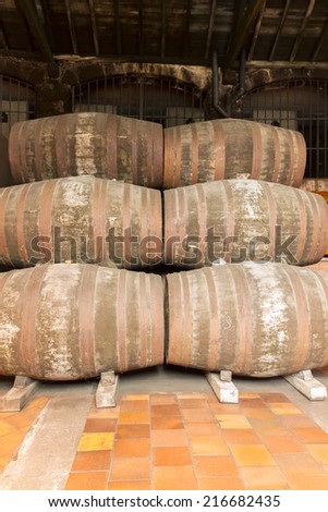 rows of traditional  aged  wooden port  wine barrels