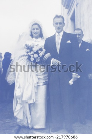 PORTUGAL, LISBON - CIRCA 1940s : old photo  of happy young  couple of woman and man  in wedding dress  Illustrative Image, subject of human interest.