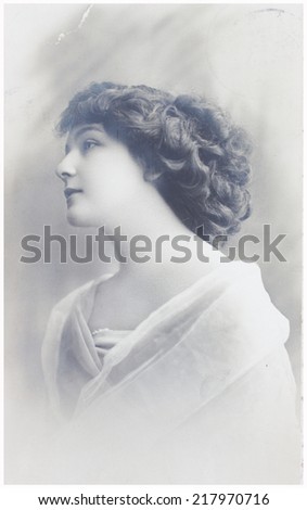 POLAND, WARSAW - CIRCA 1913: old photo portrait of young woman profile. Illustrative Image, subject of human interest