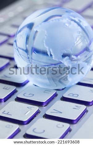global computer business concept with  globe on laptop keyboard