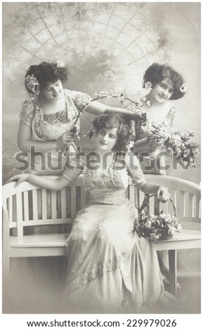 GERMANY, AAHEN - CIRCA 1911: old photo of three edwardian women, selebrating birthday. Illustrative Image, subject of human interest.