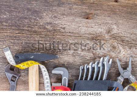 tools kit border on wooden  background with copy space