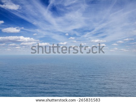 beautiful seascape with deep  blue ocean  waters and clouds