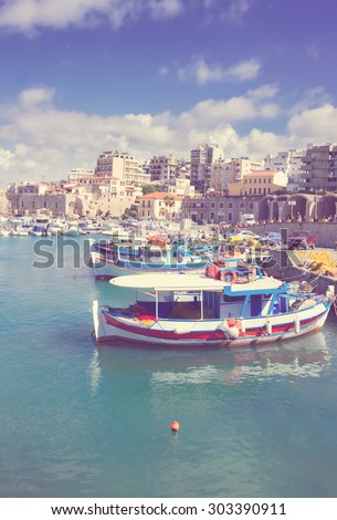 Heraklion old town port with colorful boats, at sunny day, Crete, Greece, retro toned