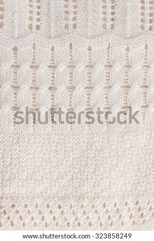 texture of white knitted soft sweater background, vertical image