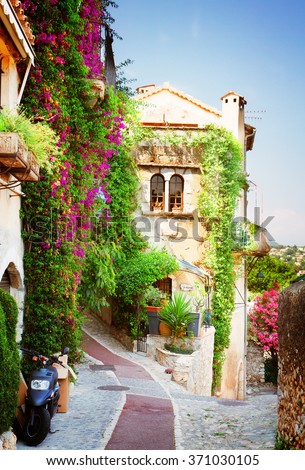 beautiful old town street of Provence at summer day, France, retro toned