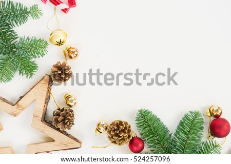 Christmas flat lay styled scene with evergreen tree twigs, Christmas decorations and copy space