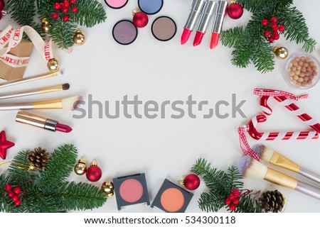 Set of Christmas make up cosmetics products frame with  copy space, top view