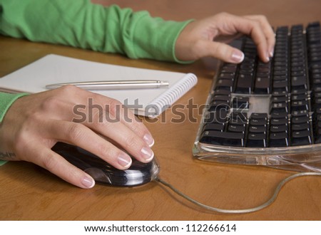 A beautiful set of hands work on the mouse and keyboard