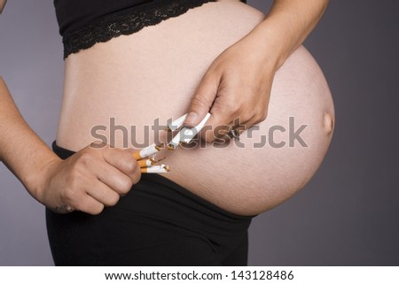 A preganant woman gives up the habit of smoking