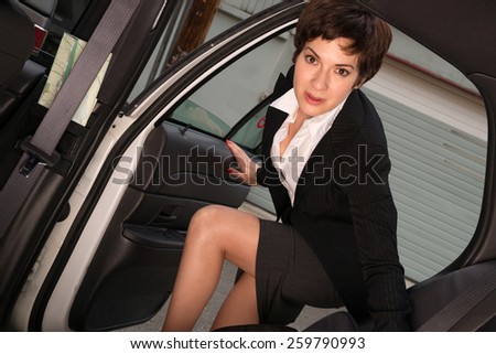 Attractive Determined Business Woman Traveler Enters Taxi Cab