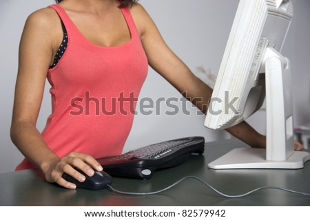 Pretty torso surfs the net Hand on Mouse Keyboard Counter-top Monitor