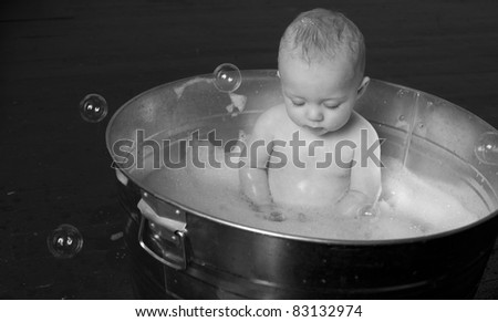 6 month old Boy bathing in a galvanized tub infant child bubble bath