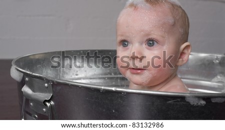 6 month old Boy bathing in a galvanized tub