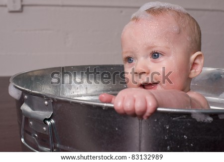 6 month old Boy bathing in a galvanized tub