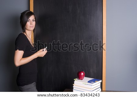Teacher communicates with returning students front of classroom educational setting