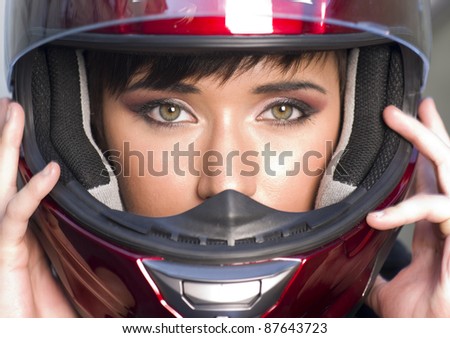 Young Vibrant Intense Girl in Red Full Face Motorcycle Racing Helmet