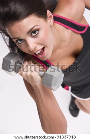 Pretty Lady Lifting Barbells Vertical Gym Workout