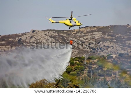 fire fighting helicopters fire on the mountain