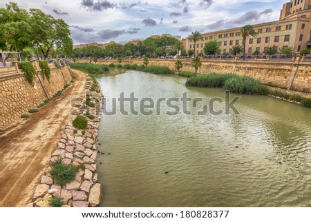 safe river crossing the city of Murcia storm one day