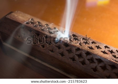 wooden box with incense and smell smoke coming out