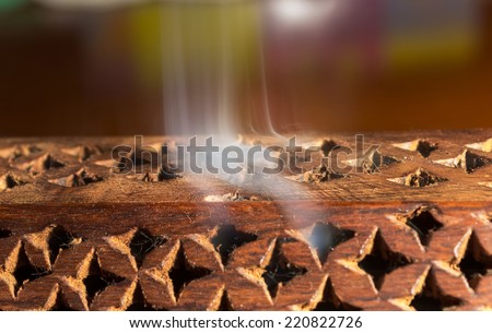 wooden box with incense and smell smoke coming out