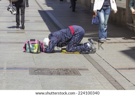 Barcelona,SPAIN - APRIL 20: poor man begging on the street April 20, 2014 in Barcelona Spain