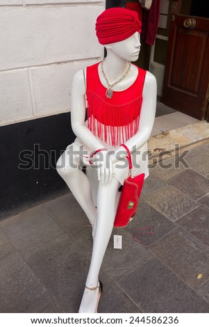 mannequin white suit and red turban