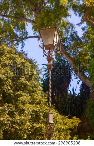 antique lamp with wrought iron ornaments