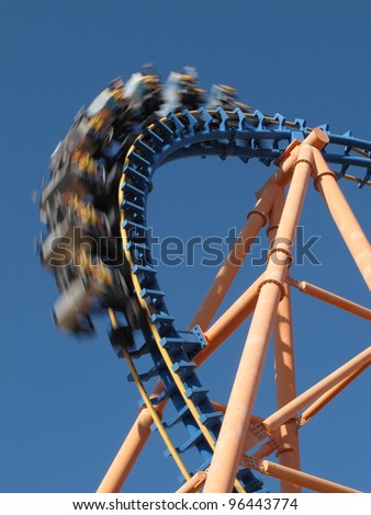 moving roller coaster with blue sky