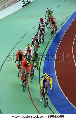 GALAPAGAR, SPAIN APRIL 6 - Cyclists in full competition for the final races of the championship of Spain for indoor track cycling teams - Cycle track of Galapagar,Spain April 2012