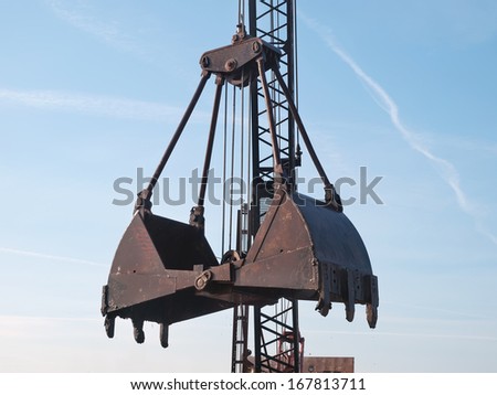 open grab bucket and crane on working site