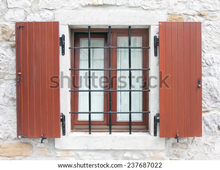 wooden window with metal window grid