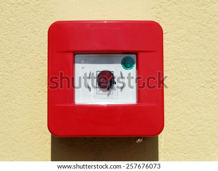 red fire alarm box on the wall