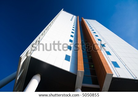 bright white office tower building wide angle view