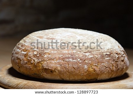 loaf of homemade bread, black background
