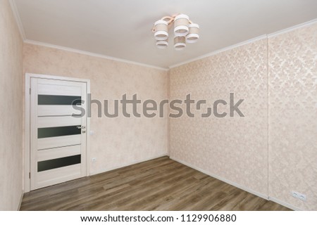 Empty light colored room in a brand new modern apartment