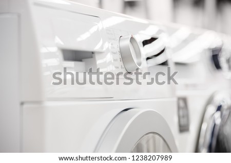 Row of washing mashines in appliance store