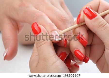 beauty salon, manicure applying, cleaning the cuticles