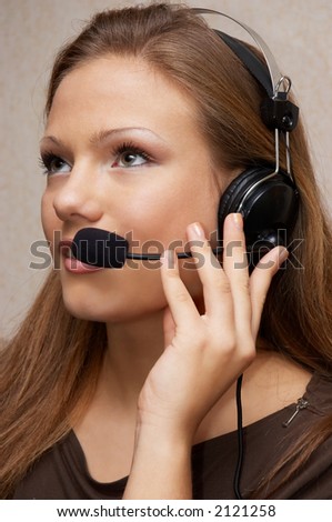 Pretty customer support girl with headset, listening to customer