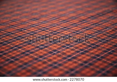 checkered celtic style fabric textured background. shallow DOF.