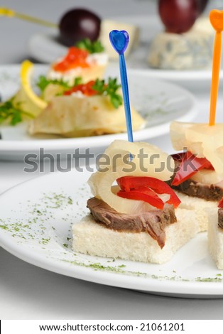 canape with meat, pineapple and red pepper