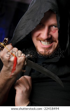 man with dagger wearing black