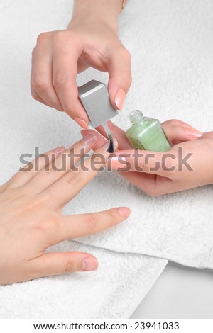applying manicure: moisturizing the nails and skin around nails